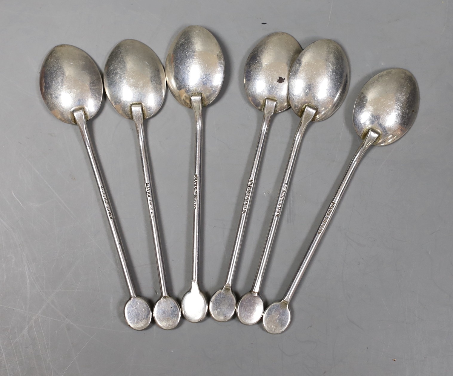 A set of six Australian sterling coffee spoons, with oval black opal doublet set terminals, 92mm.